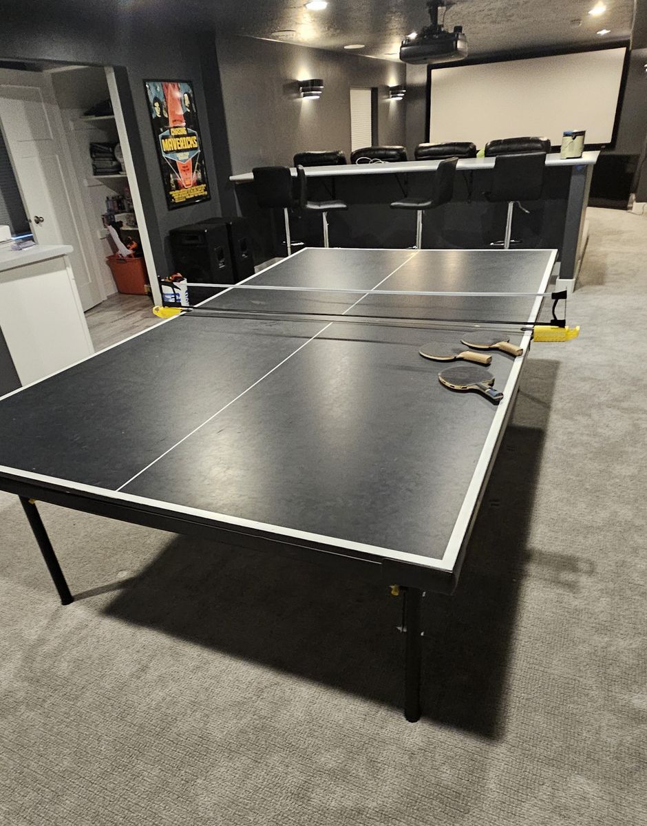 Stiga Legacy Table Tennis Table featuring a black tabletop with white edge stripes.
