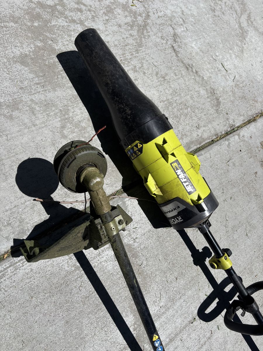 RYOBI 25cc 2-stroke attachment capable gas string trimmer with blower attachment
