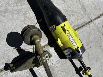 RYOBI 25cc 2-stroke attachment capable gas string trimmer with blower attachment
