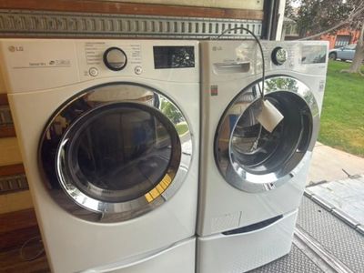 Beautiful LG Front Load Washer and Electric Dryer with Pedestals