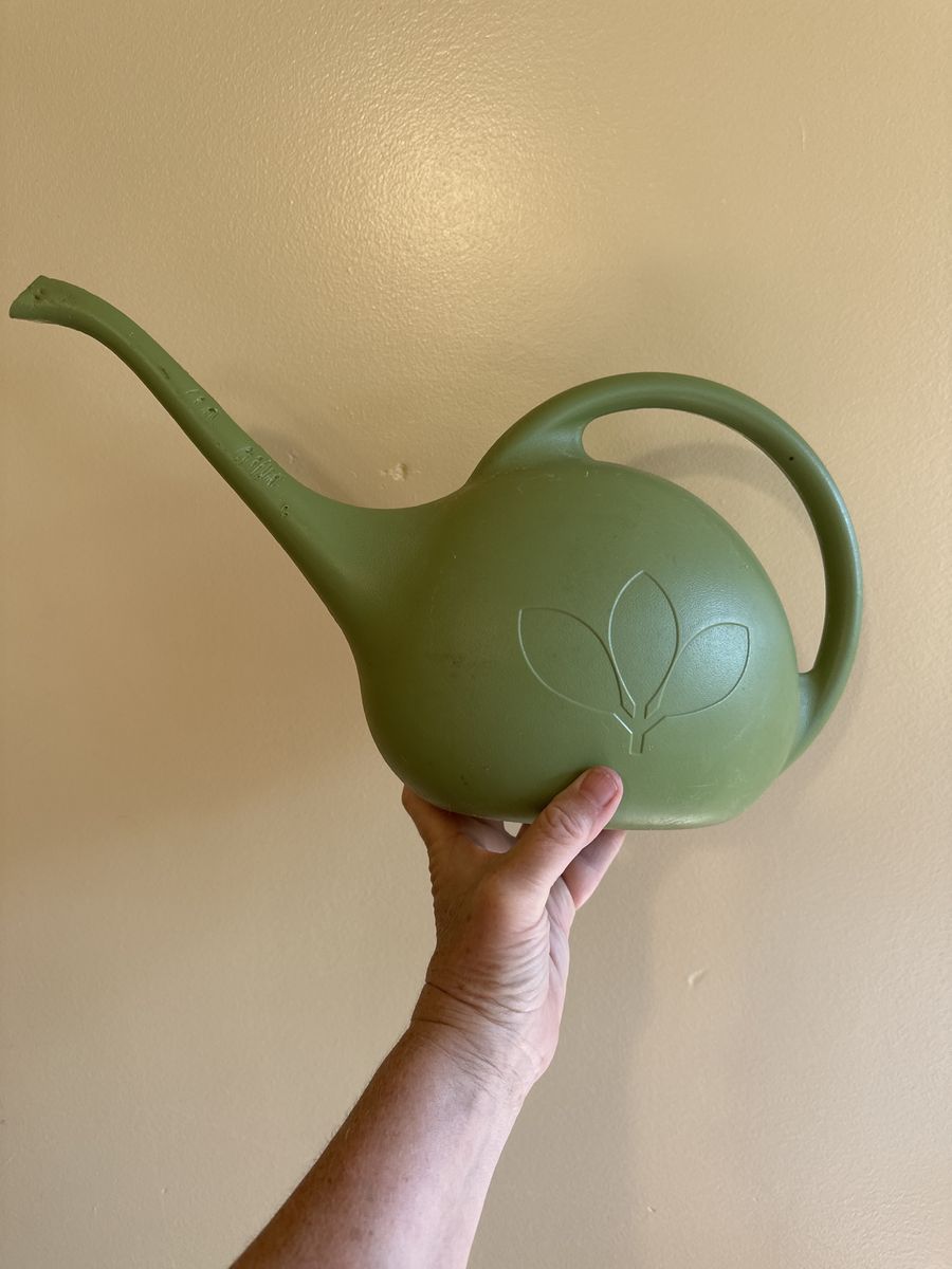 Water can for house plants. Looks like it is from the ‘70’s green plastic.
