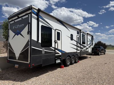 2021 Keystone Fuzion 429 Luxury Toy Hauler – Solar, MORryde Suspension, New Tires & Washer/Dryer