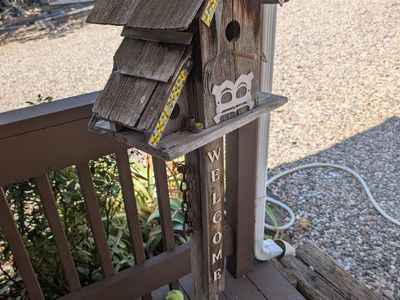 Cute rustic wooden Bird house with Welcome