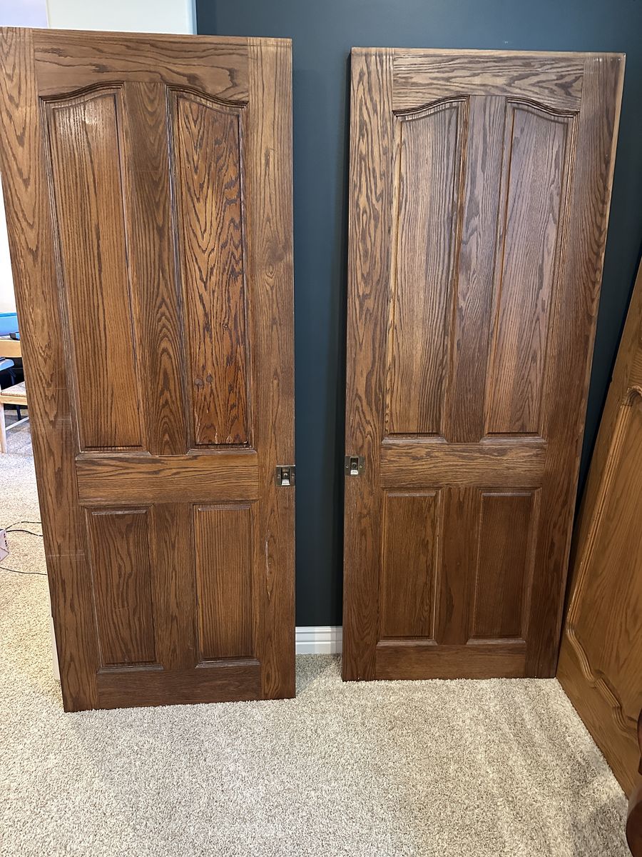 Quality solid wood interior doors removed during a remodel. These are not hollow-core or MDF—they are solid wood construction.