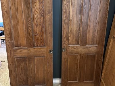 Quality solid wood interior doors removed during a remodel. These are not hollow-core or MDF—they are solid wood construction.