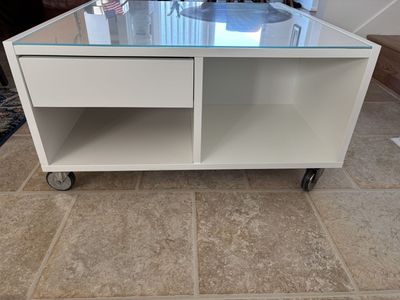 Roller glass top coffee table