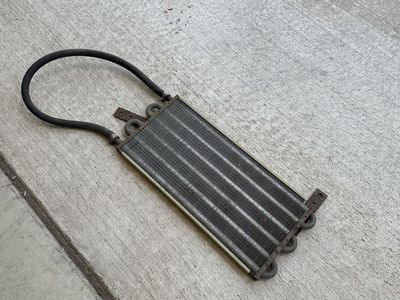 Used Transmission Oil Cooler with Attached Hose and Mounting Brackets