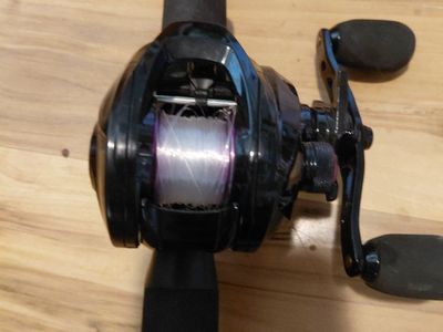 Baitcasting Fishing Reel with Fishing Rod - Pre-spooled with line, black and red