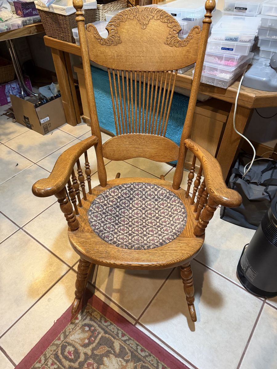 Vintage Oak Wood Rocking Chair with Carved Back and Patterned Seat Cushion