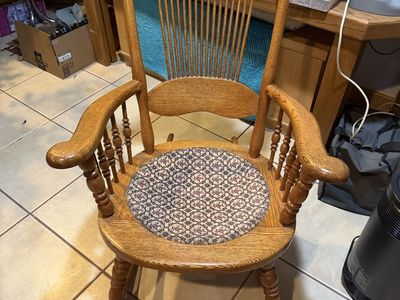 Vintage Oak Wood Rocking Chair with Carved Back and Patterned Seat Cushion
