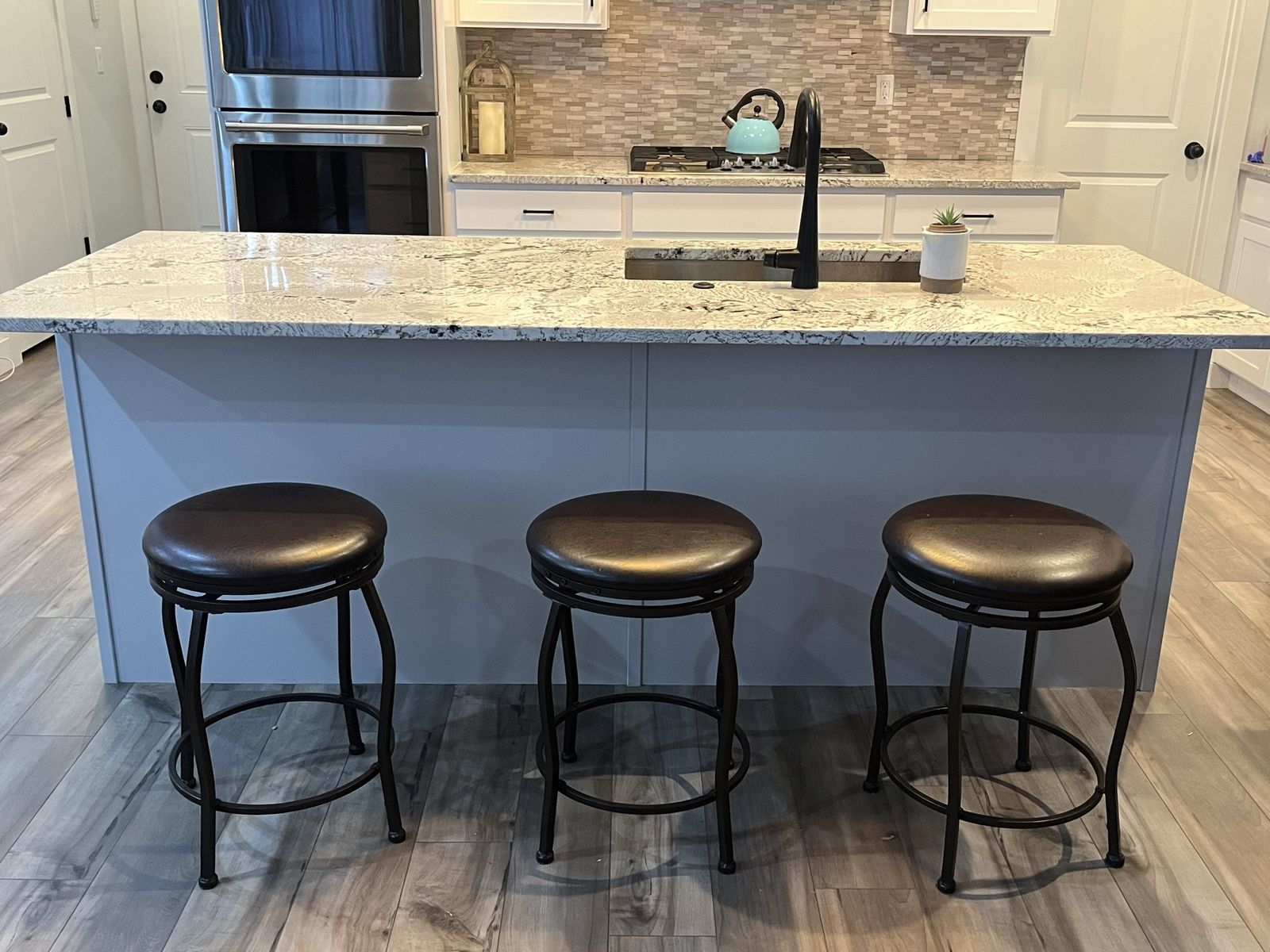 Set of 3 Swivel Bar Stools with Dark Brown Padded Seats and Metal Frames