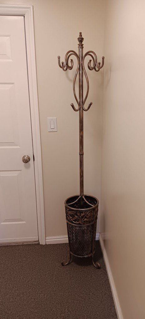 Standing coat hanger/umbrella holder.