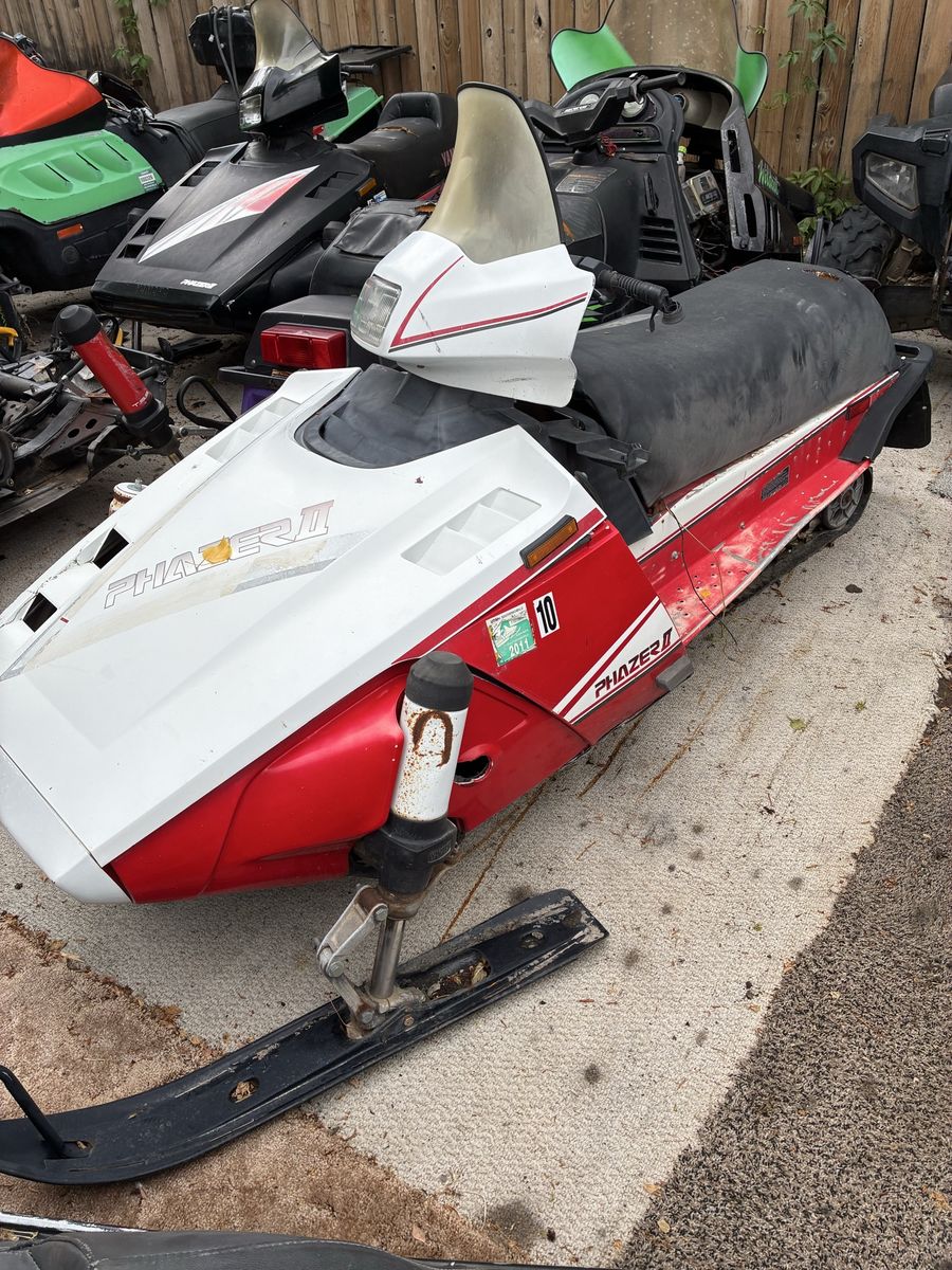 3 scrap metal snowmobiles
