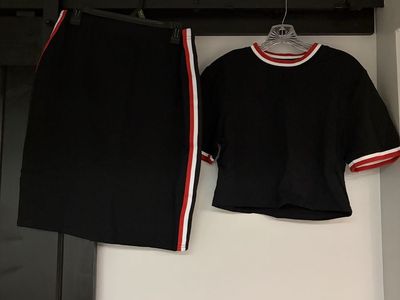 Brand new two piece black short sleeved top and skirt
