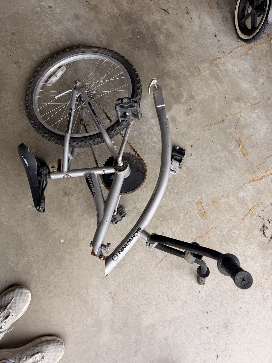 Tag-along bike attachment