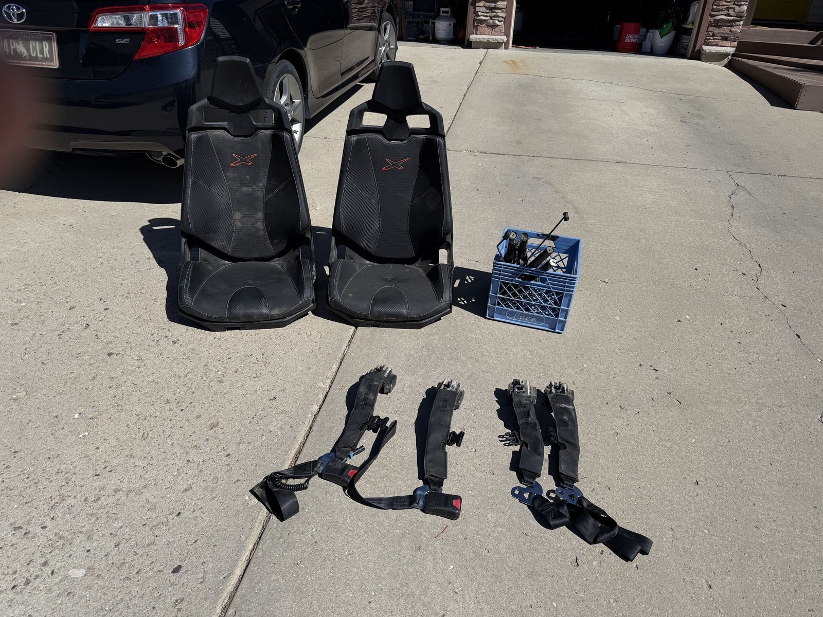 Can Am OEM seats and 4 point retractable harness.