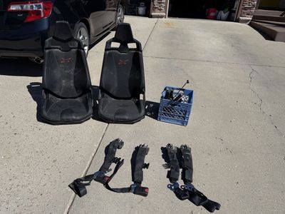 Can Am OEM seats and 4 point retractable harness.
