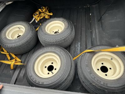4 golf cart tires and rims.