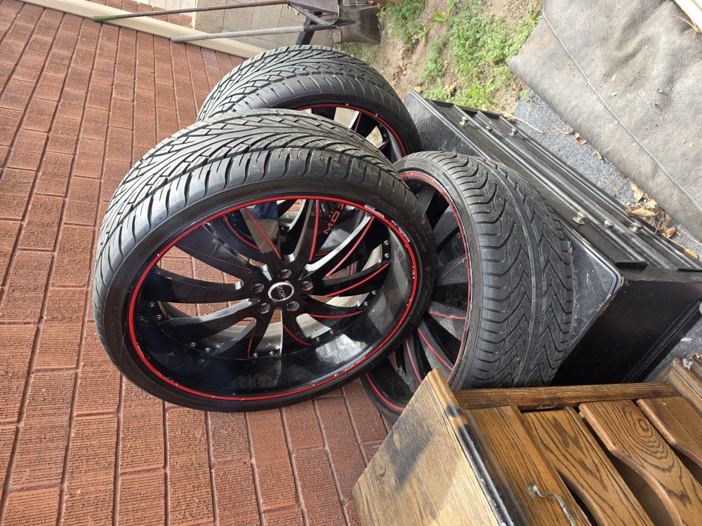 3 black and red MOZ 24" rims and low profile tires