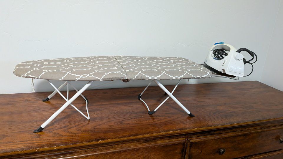 Portable ironing board with bonus iron