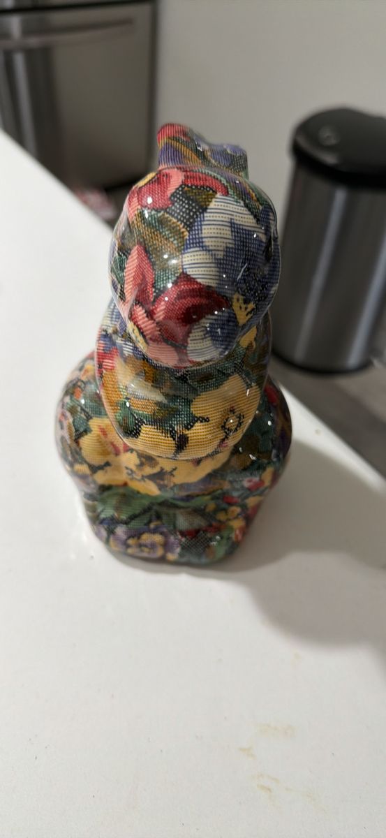 Ceramic floral print rabbit figurine. 7”