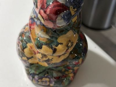 Ceramic floral print rabbit figurine. 7”