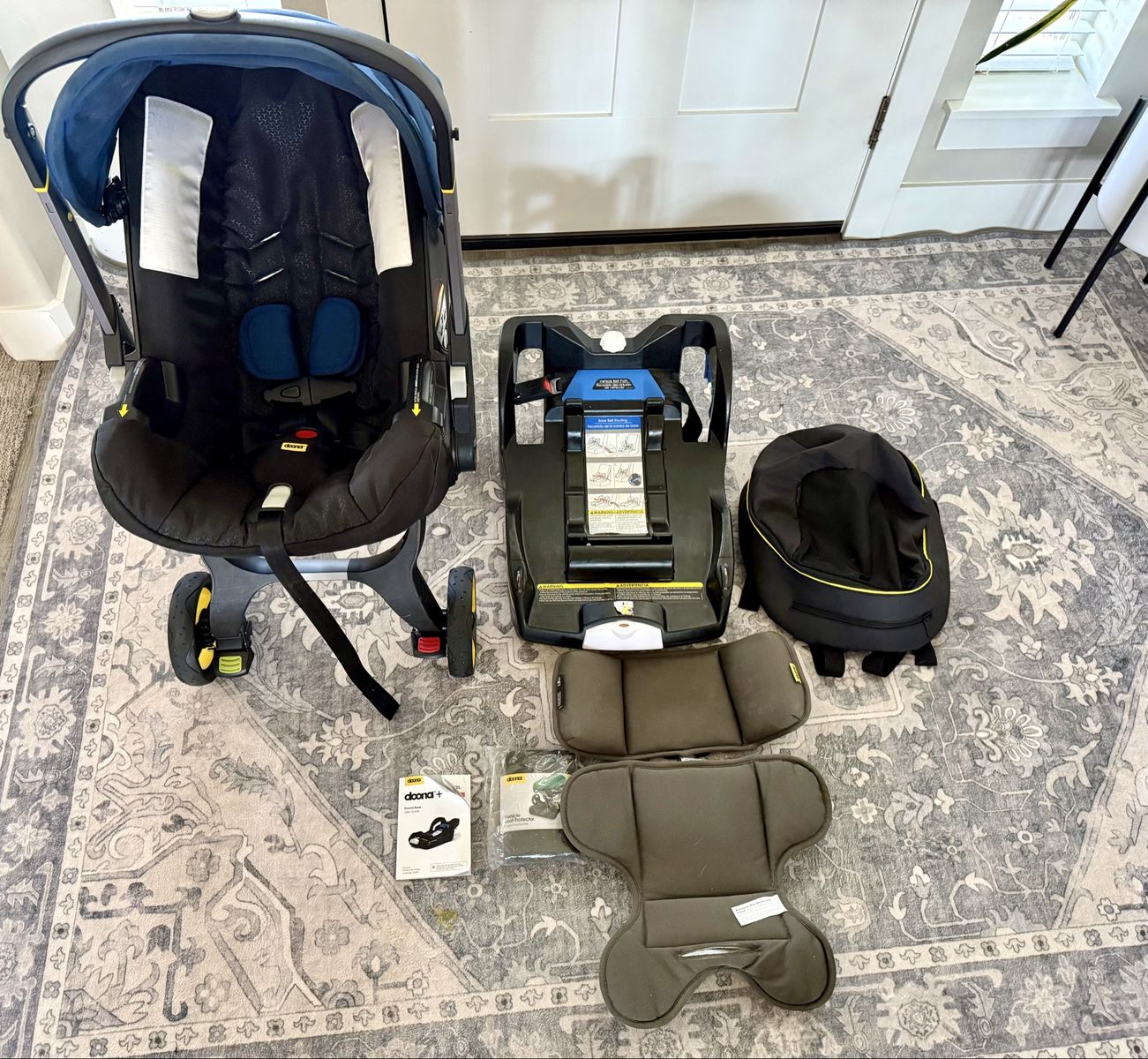 Doona Infant Car Seat & Stroller + Base + Storage Bag