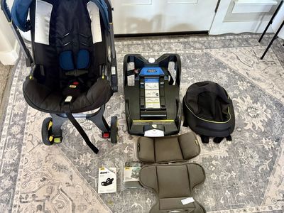 Doona Infant Car Seat & Stroller + Base + Storage Bag