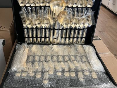 63-piece gold-plated flatware service for 12