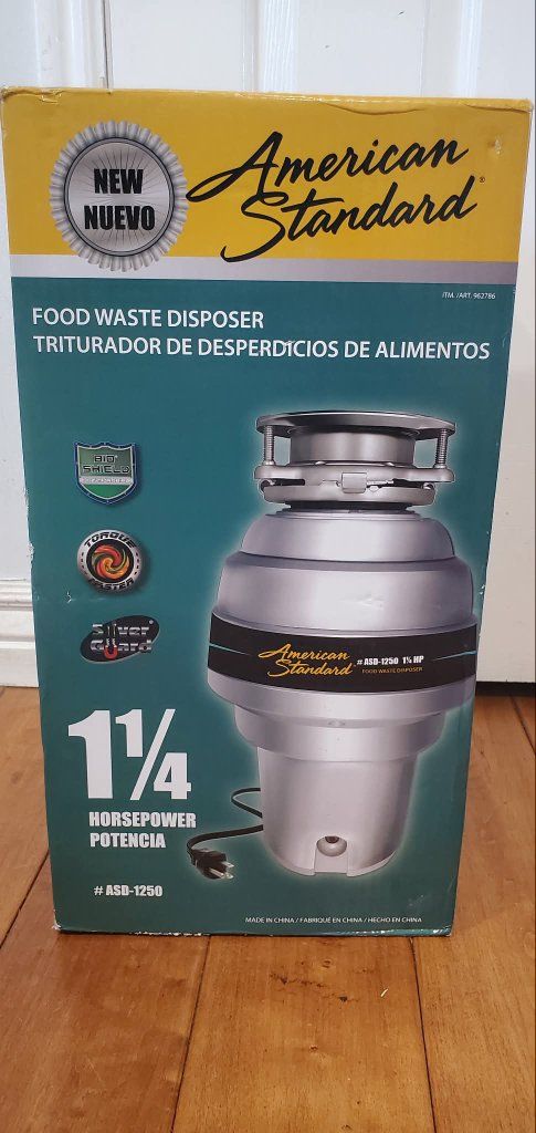 New American Standard 1 1/4 horsepower kitchen food waste disposer.
