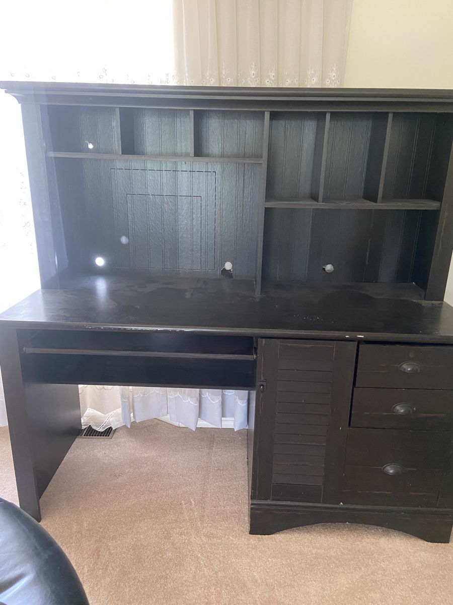 Black Wooden Office Desk with Attached Hutch Shelving and Drawers