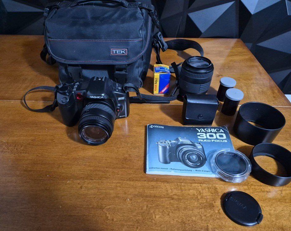 Yashica 300 AF 35mm SLR Film Camera w/Yashica 28-70mm AF Zoom 1:3.5-4.5 Lens, Vintage Sigma 70-210mm 1:4 -5.6 Zoom Lens, Batteri