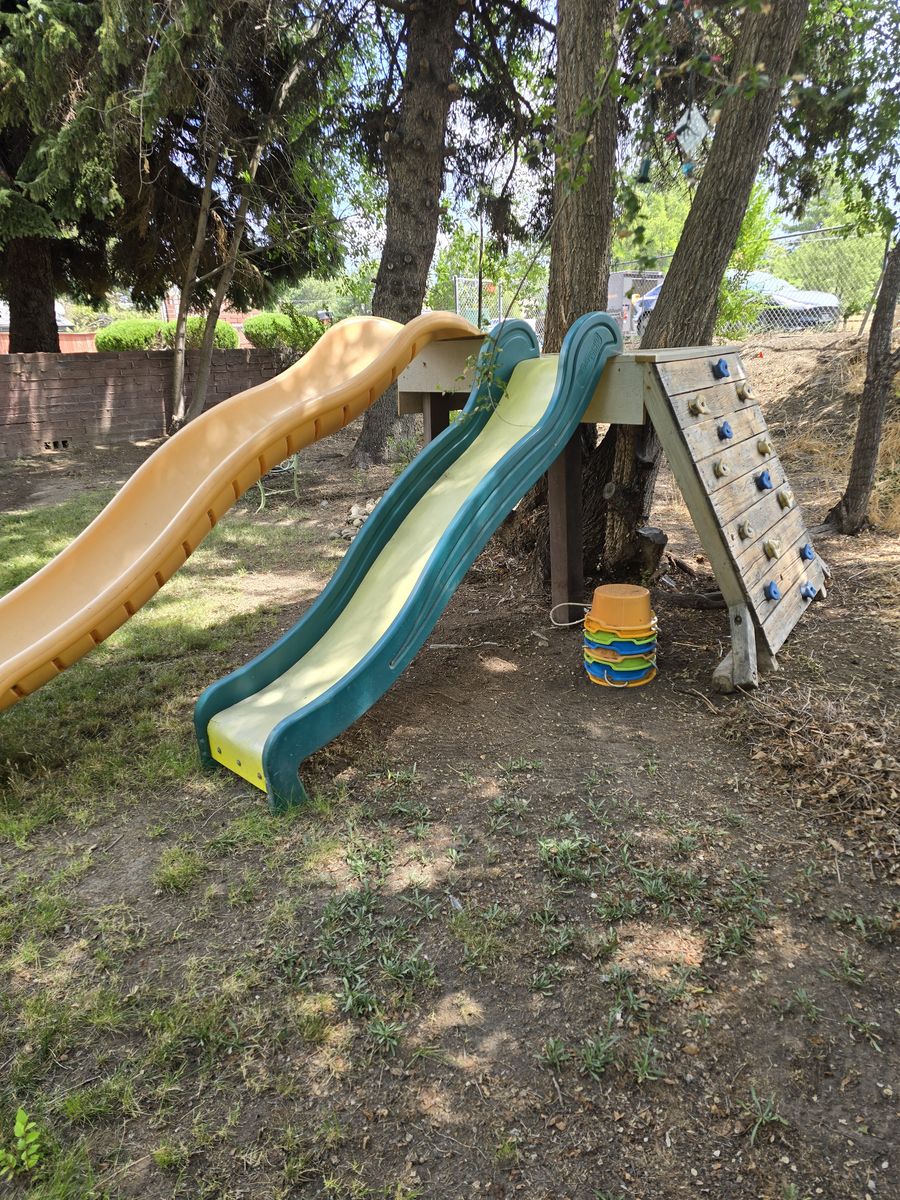 Used Backyard Playset with Double Slides and Climbing Wall - Perfect for Outdoor Fun