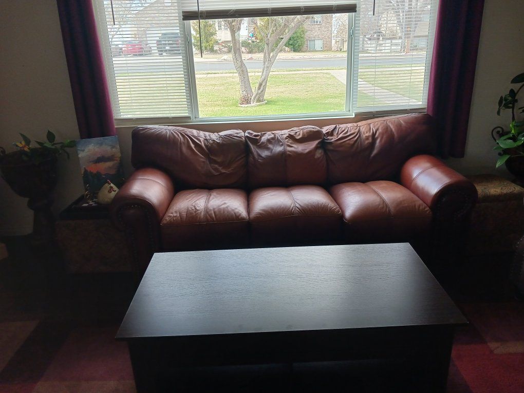 Leather couch and oversized chair and ottoman