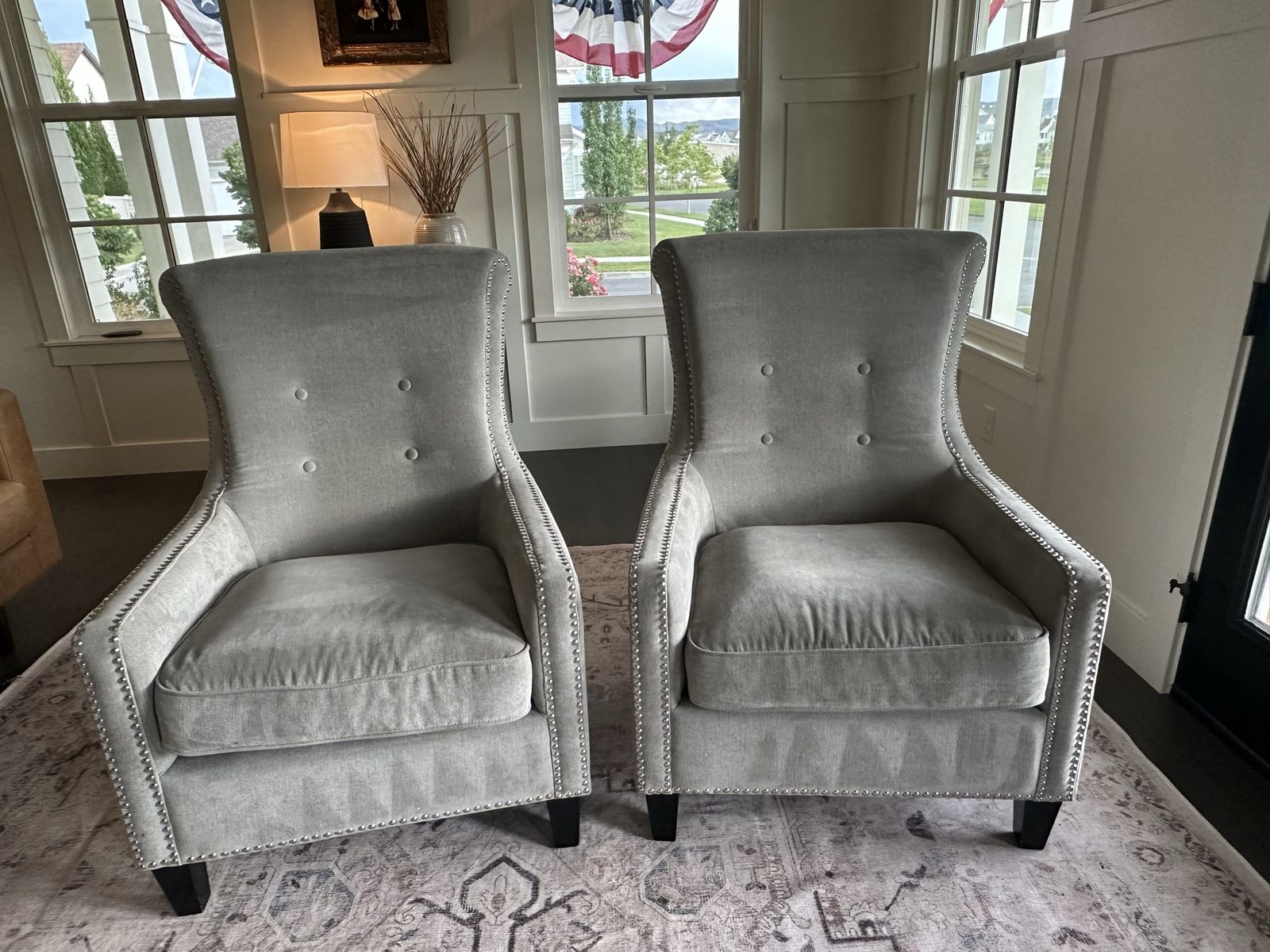 Pair of Gray Tufted Wingback Accent Chairs with Nailhead Trim