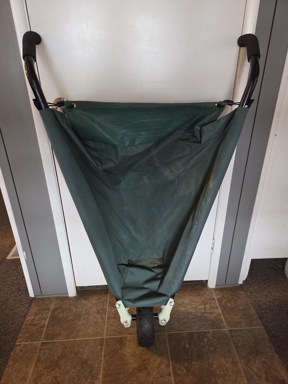 WheelEasy LE Foldable Garden Cart, also known as a collapsible wheelbarrow