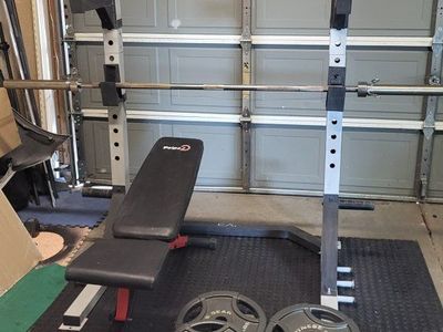 Squat rack and 255 pounds of weights