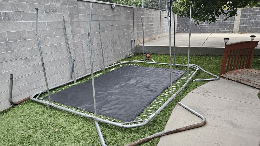 Used Rectangular Trampoline Frame, Mat, and Poles - Needs Assembly & Some parts