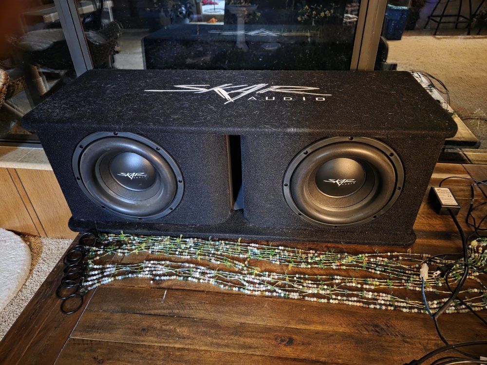 dual 10" skar audio subs, amp, and line output converter