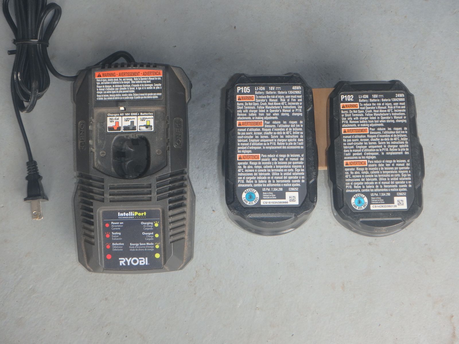 Ryobi One Battery Charger and 2 batteries (4.0 Ah battery, 1.5 Ah battery)