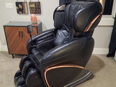 Cozzia black leather massage chair.