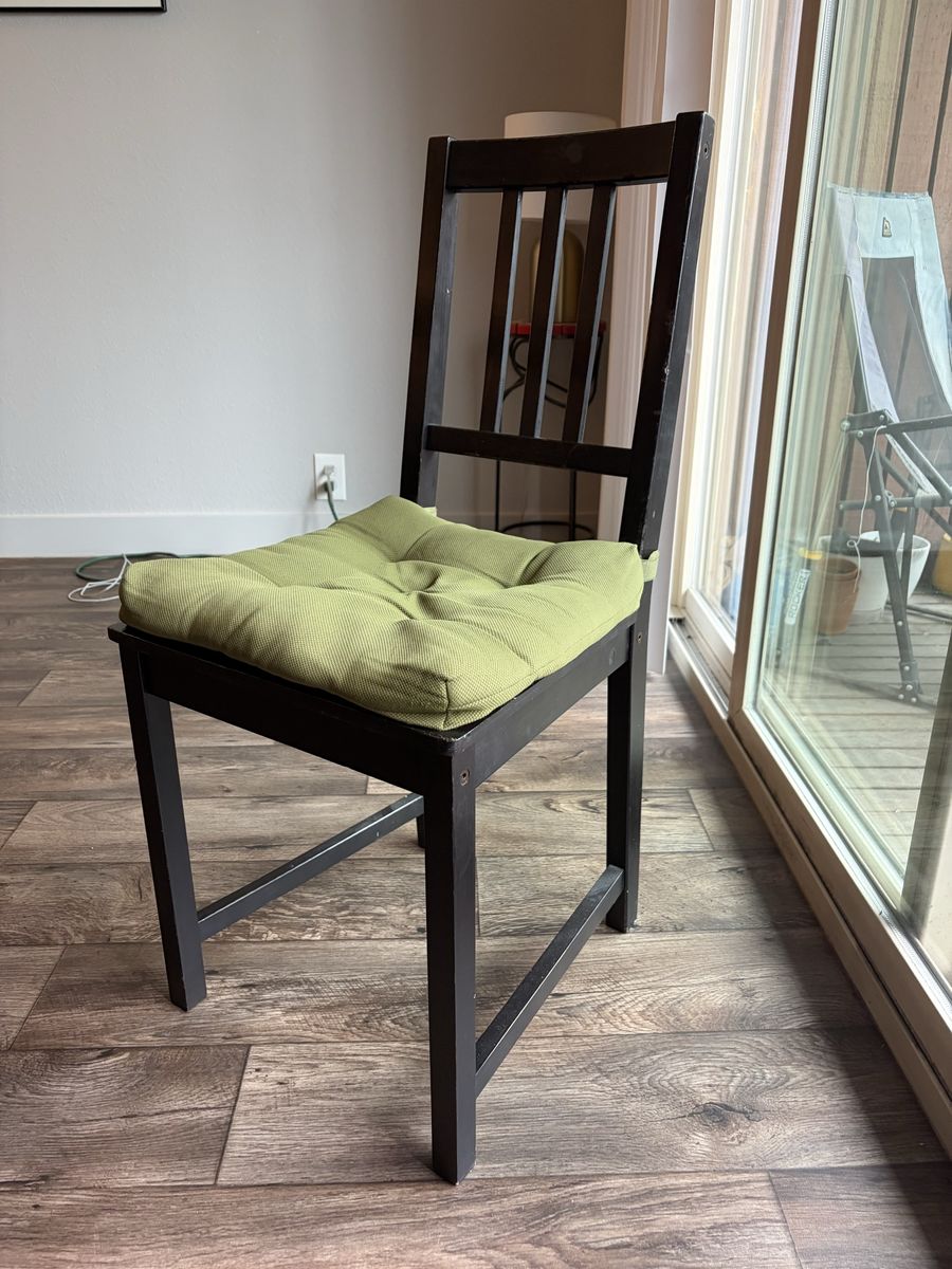 Set of four black chairs + seat covers