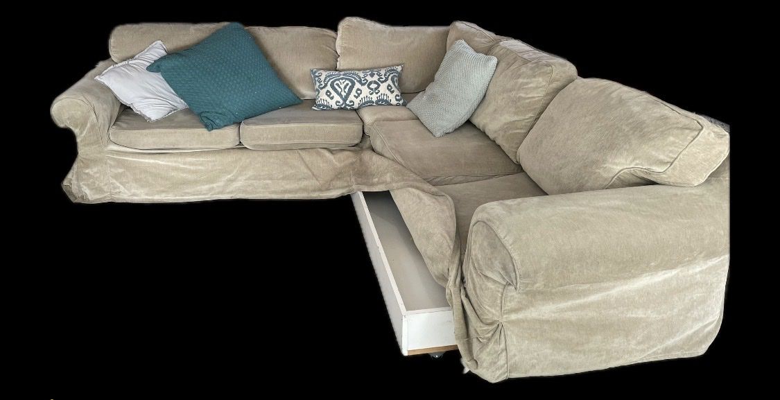 Sectional couch with tan washable cover , trundle bed and storage. Used 