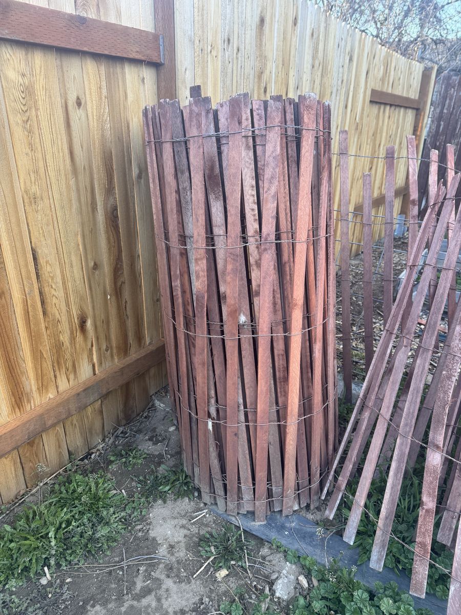 red-stained wood snow fence aprox. 20/30ft