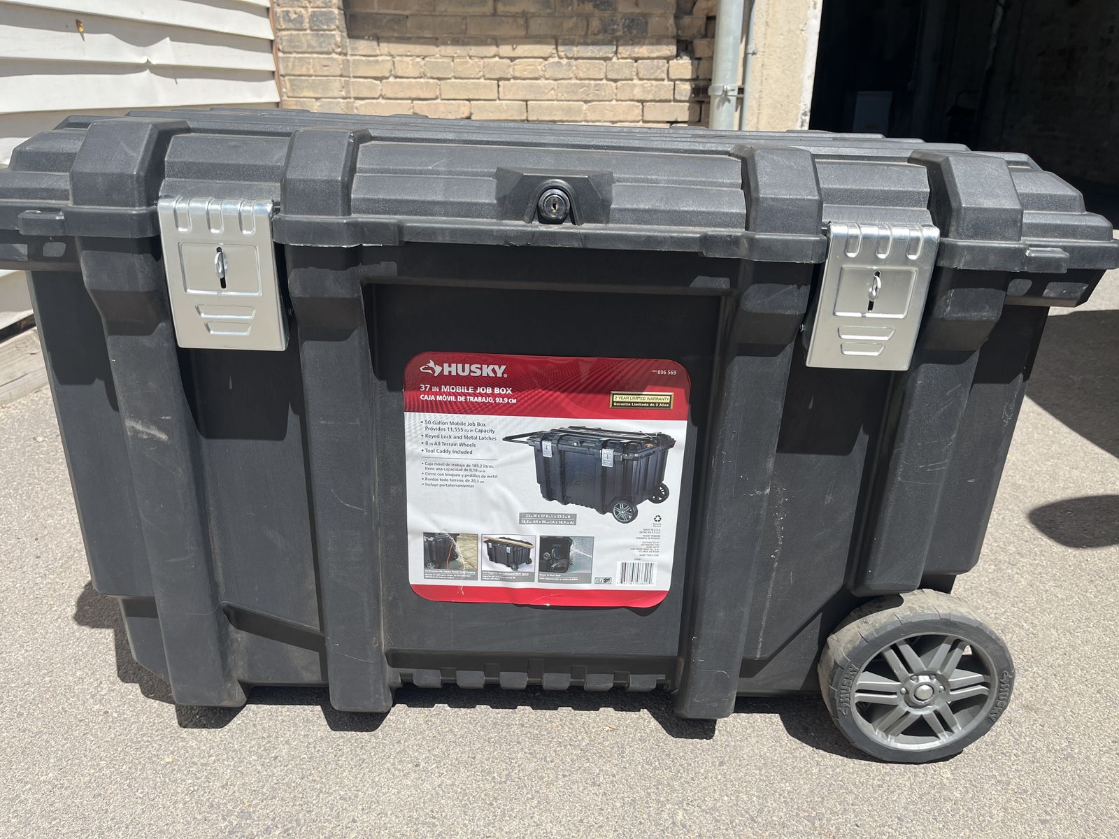 Husky 37 in. Rolling Tool Box Utility Cart with a 50-gallon capacity and a keyed lock system.