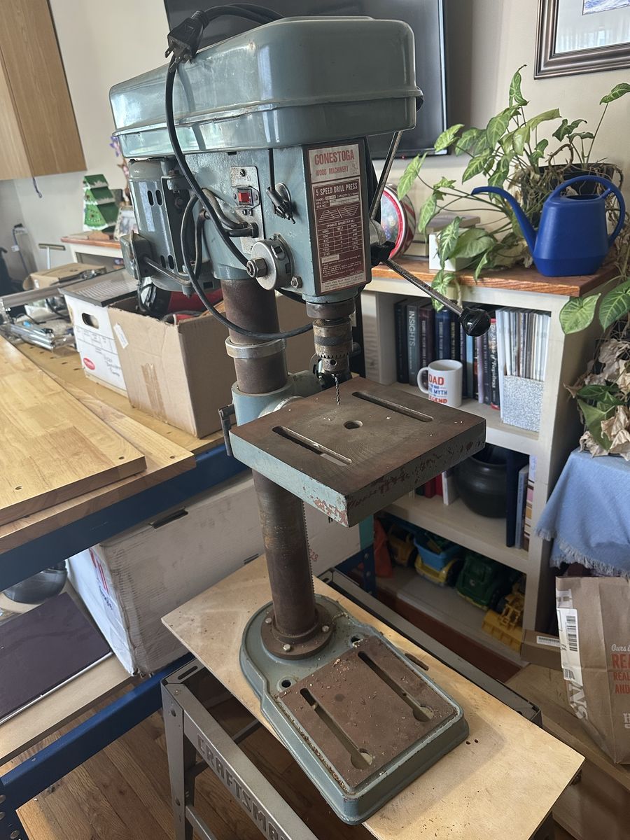 Vintage drill press and stand.