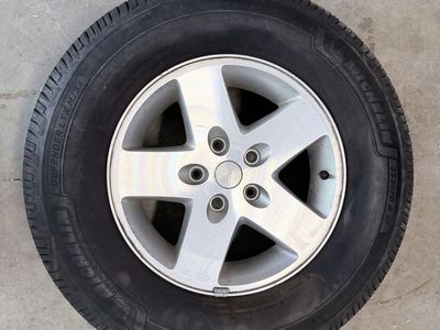 For sale: Set of 5 Original 2011 Jeep Wrangler Sport Rims with Michelin Defender LTX M/S2 Tires