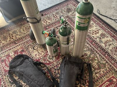 Medical Oxygen Tanks Lot with Regulators, Rolling Cart & Carrying Bags