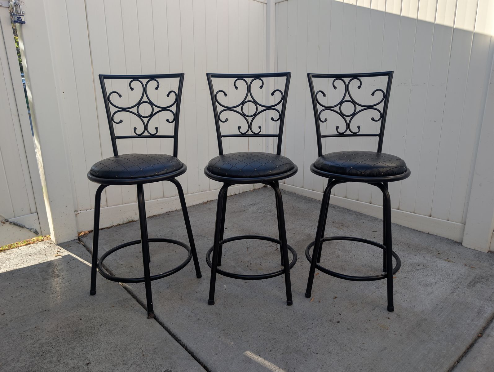Set of 3 Black Wrought Iron Swivel Bar Stools with Padded Faux Leather Seats