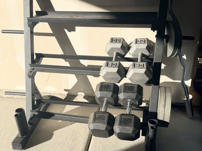 Dumbbells, 50lbs and 70’s plus rack